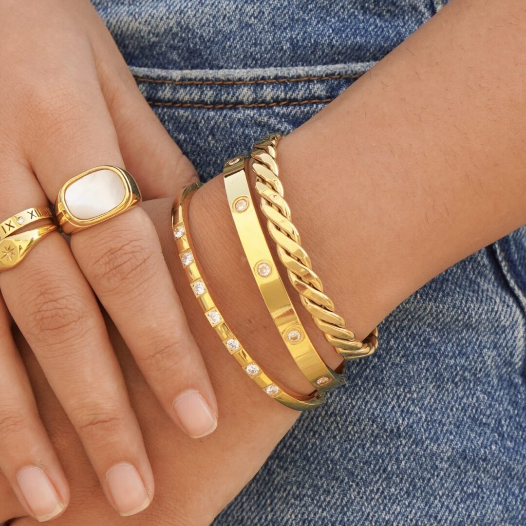 Twisted Cuff — gold twisted cuff worn on the wrist