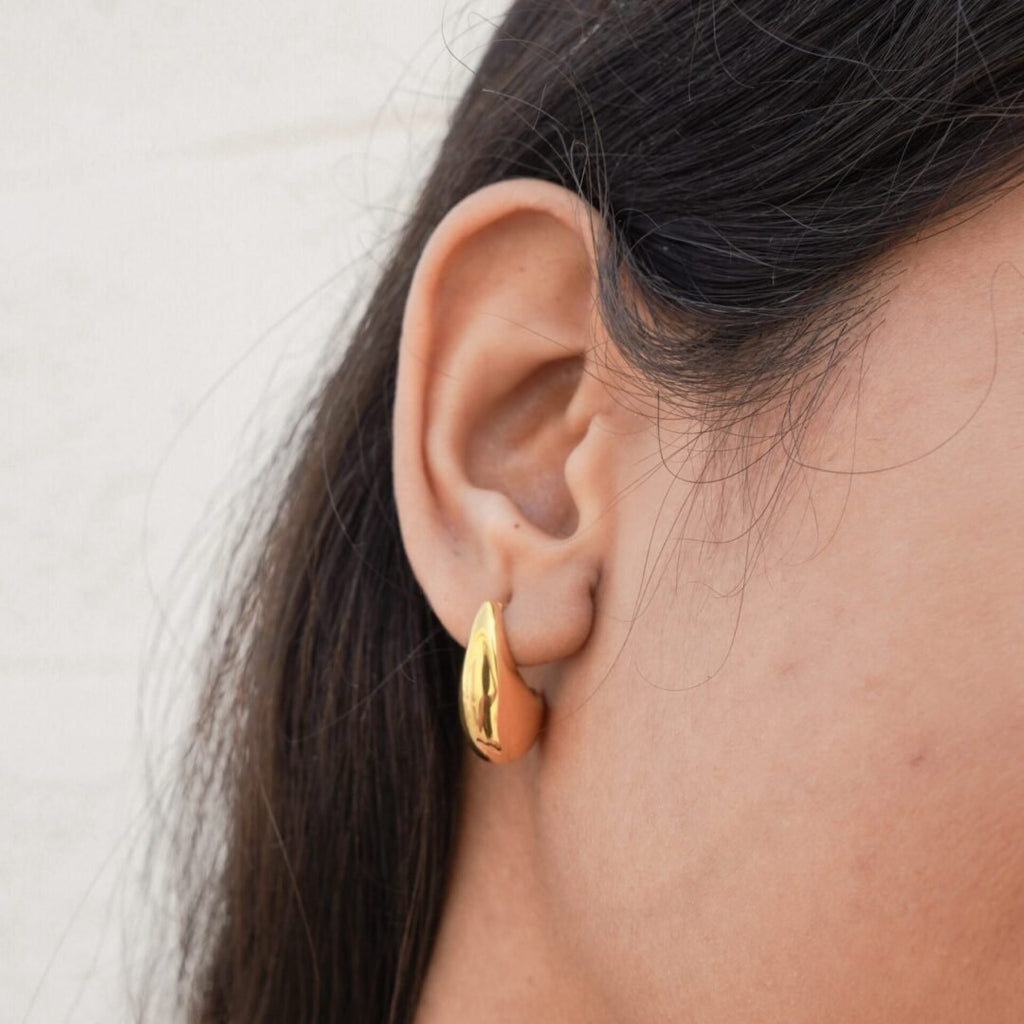 Drop Earrings — gold-plated drop earrings worn on the ear
