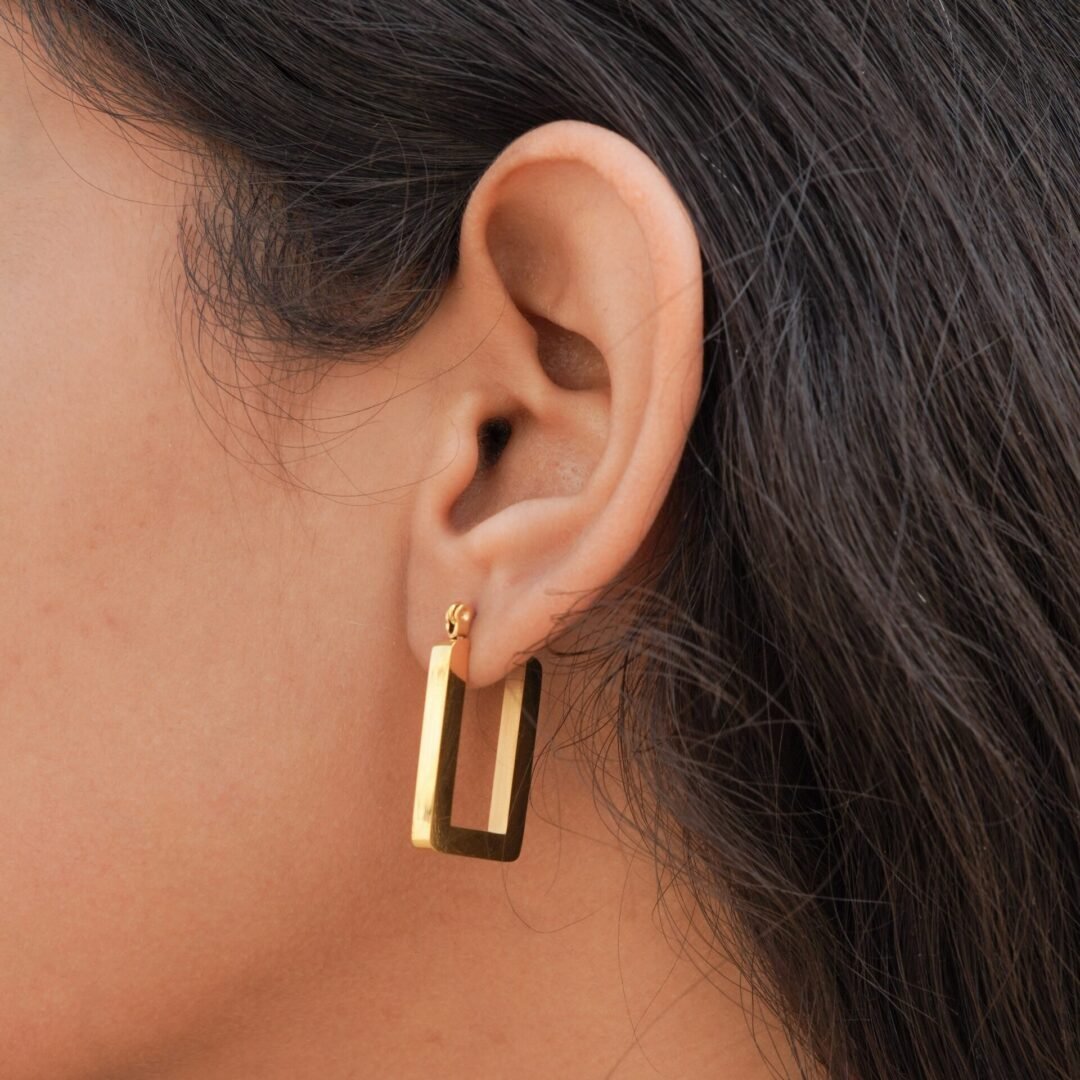 Square U Hoops — angular gold-plated hoops worn on the ear