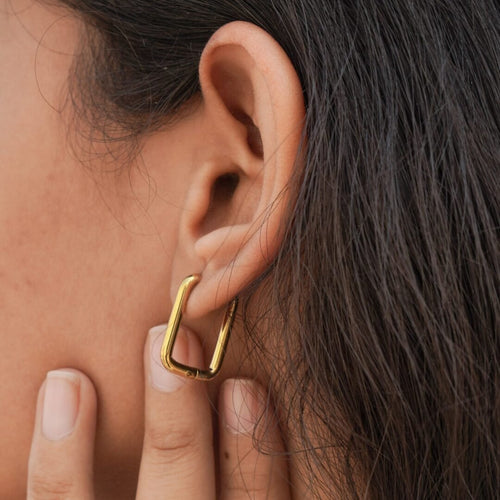 Basic U Hoops — gold-plated U-shaped earrings worn on the ear