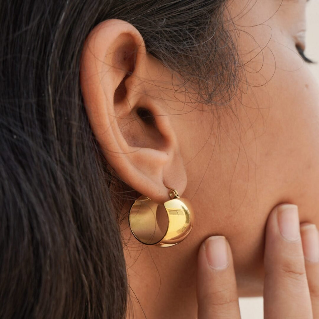 Sophia Hoops — oval gold-plated hoops worn on the ear