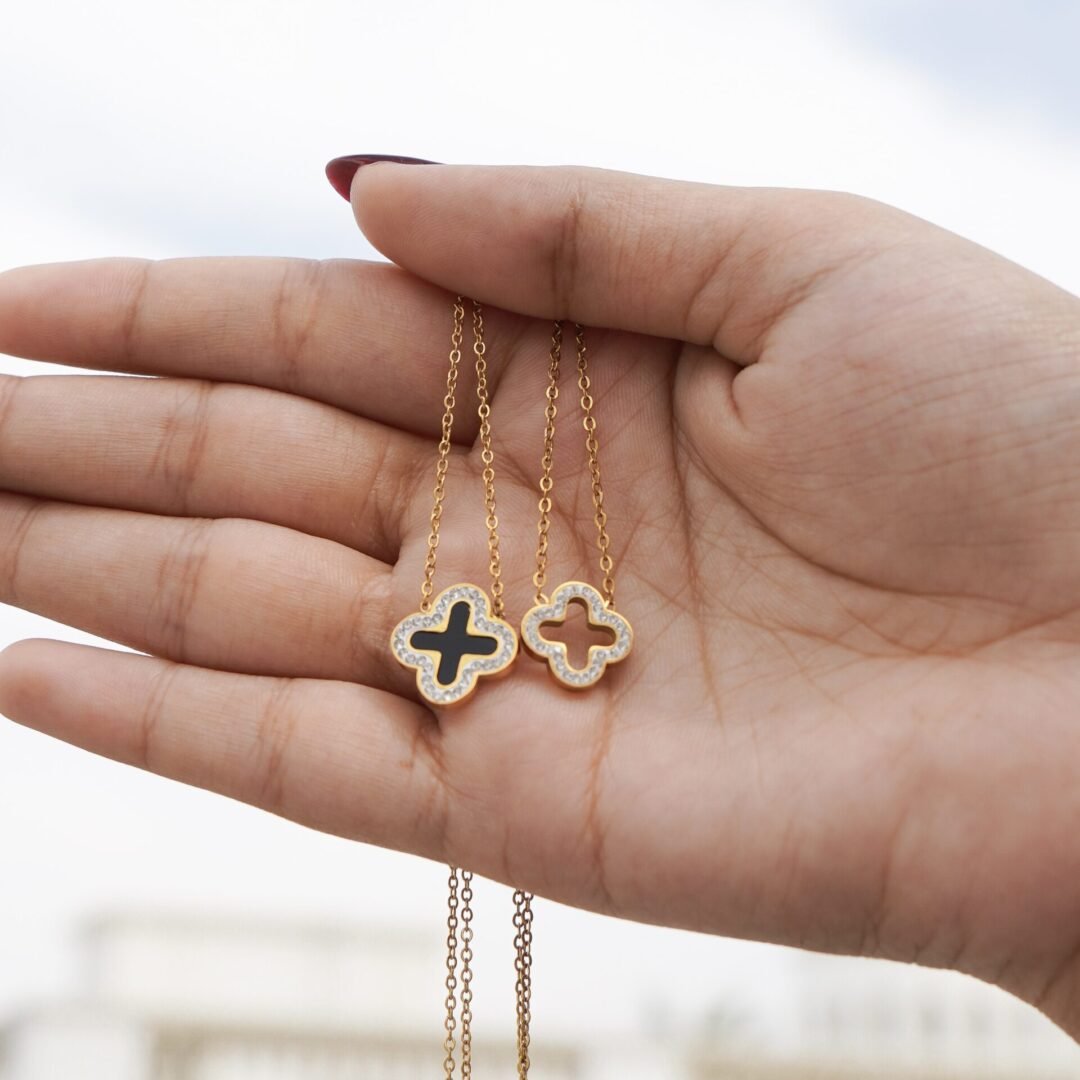 Clover Necklace Hollow — hollow clover pendant worn at the collarbone