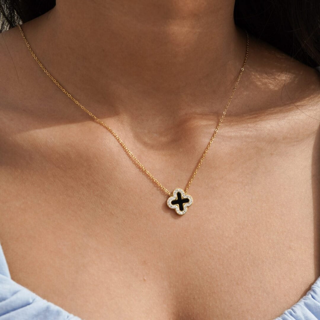 Clover Necklace Black — black four-leaf clover pendant in 14k gold-plated stainless steel, front view