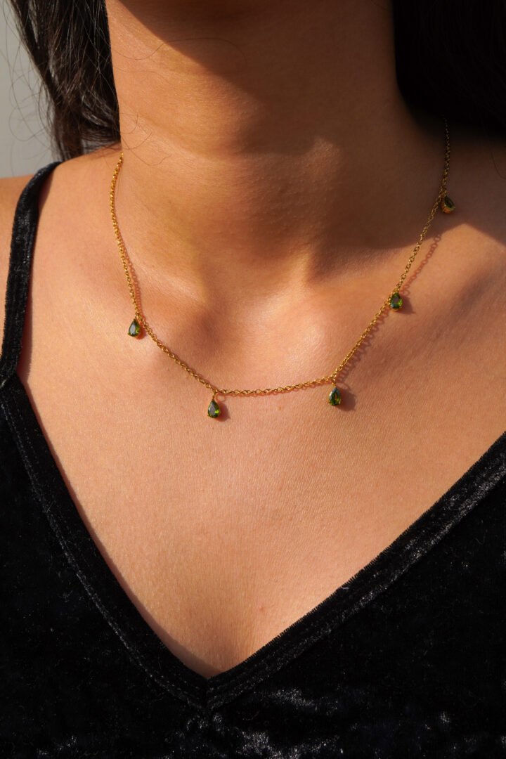 Olive Necklace — zircon chain worn at the collarbone