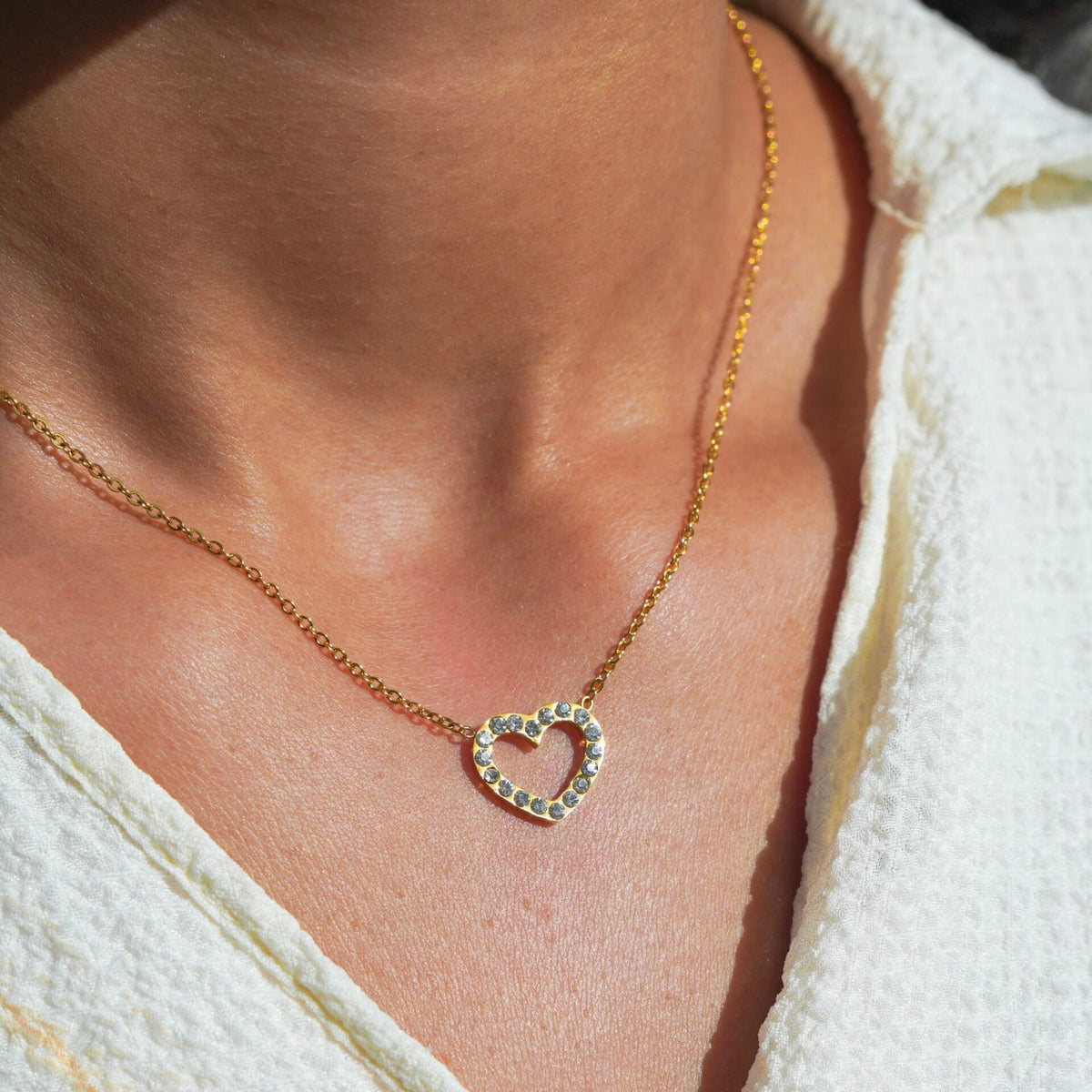 Heart — zircon heart necklace worn at the collarbone