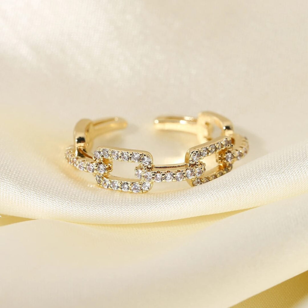 Link Ring White — gold-plated zircon link ring worn on the finger