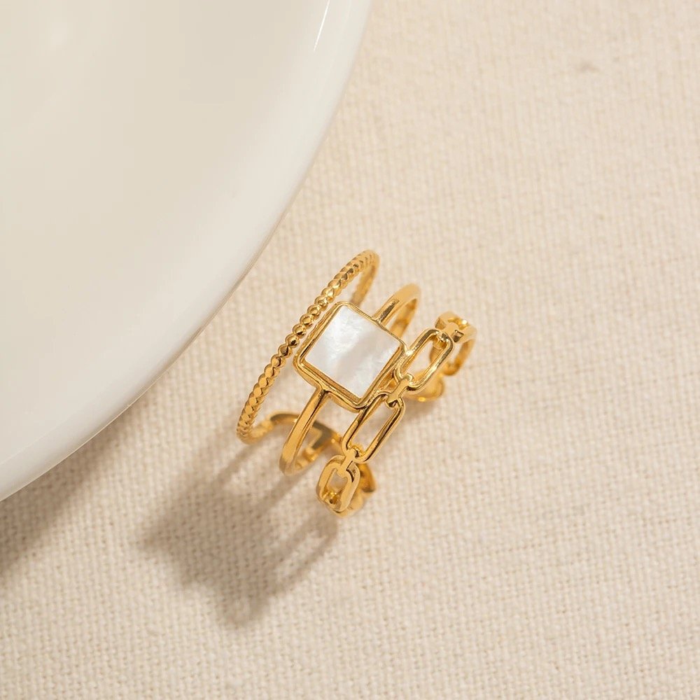 Mabel — gold band ring worn on the finger