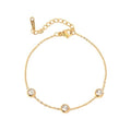 Three Wishes Bracelet — three-stone zircon chain bracelet in 18k gold plating, front view