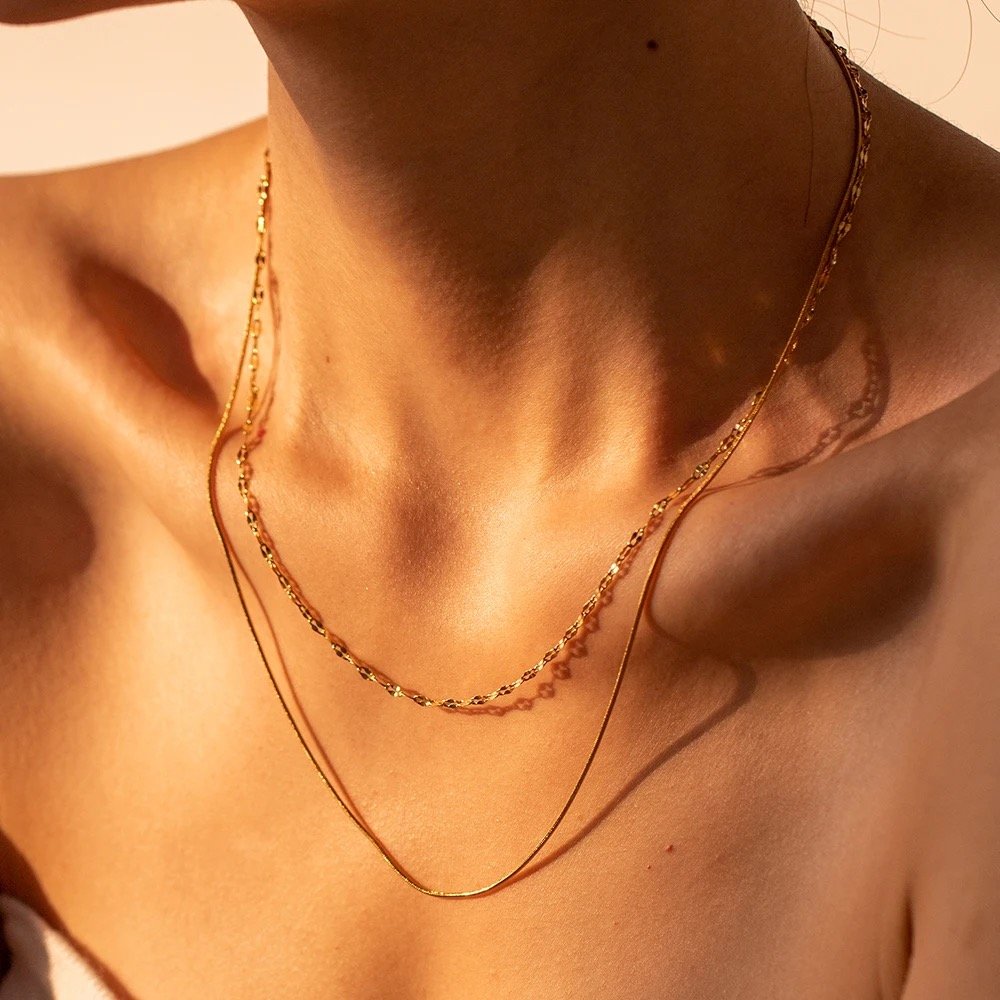Louis — gold pendant necklace worn at the collarbone