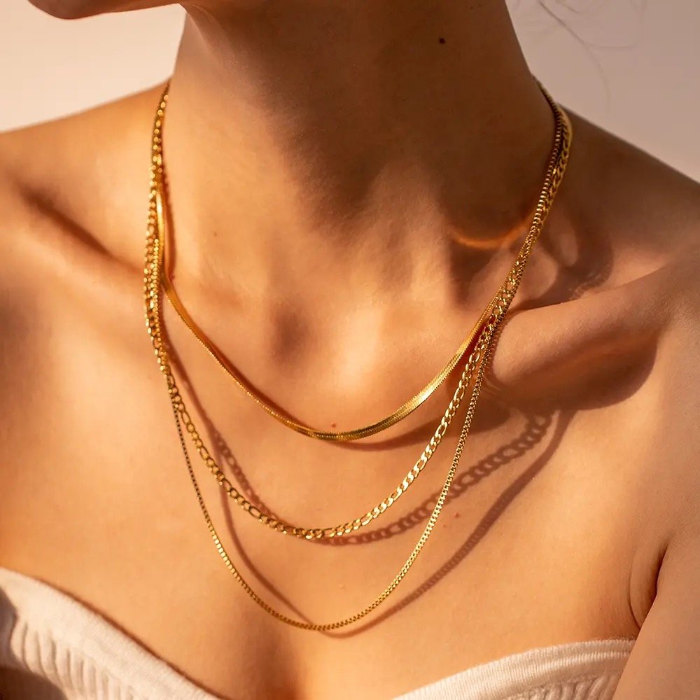 Bea — gold pendant necklace worn at the collarbone