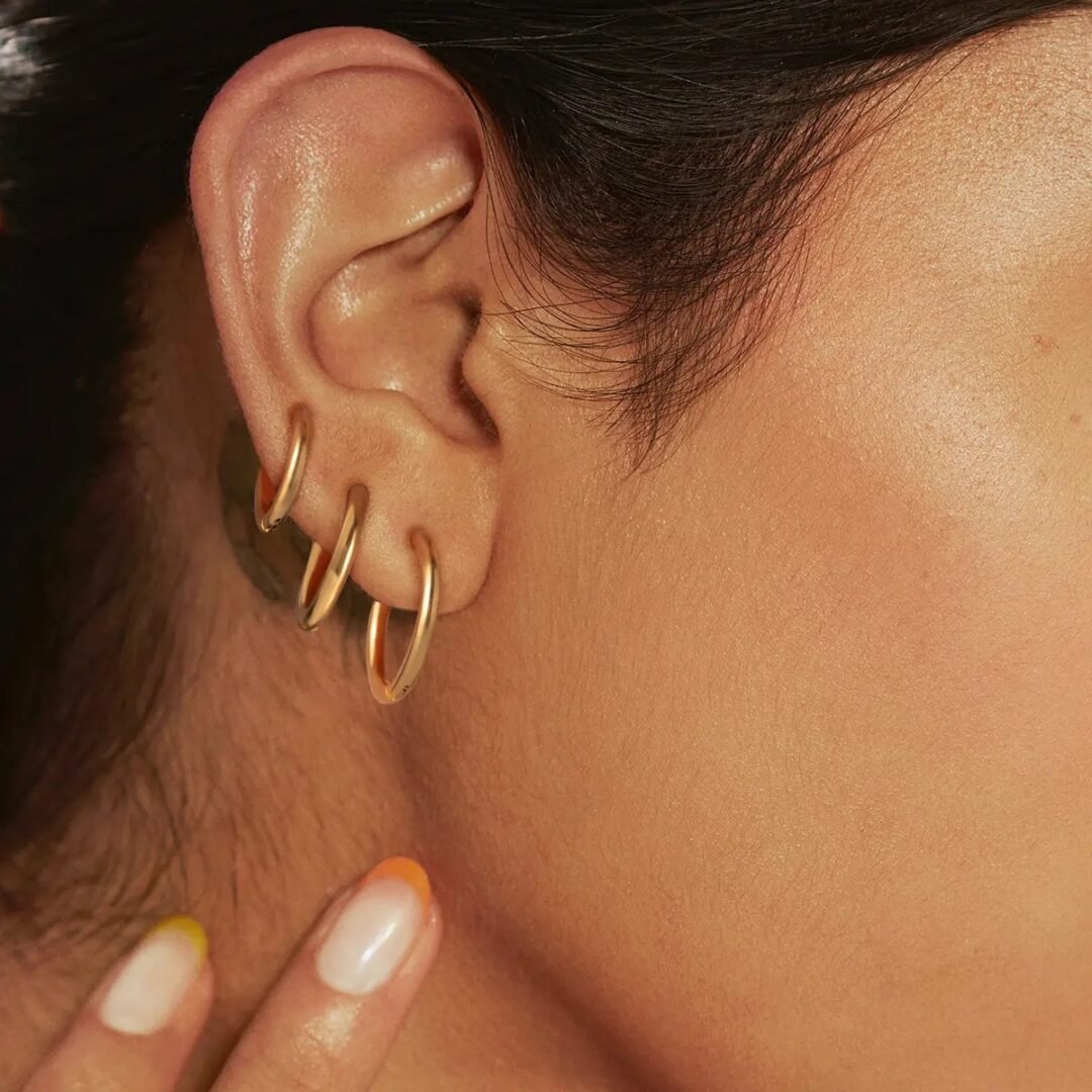Huggies Set — huggie hoops worn across multiple piercings