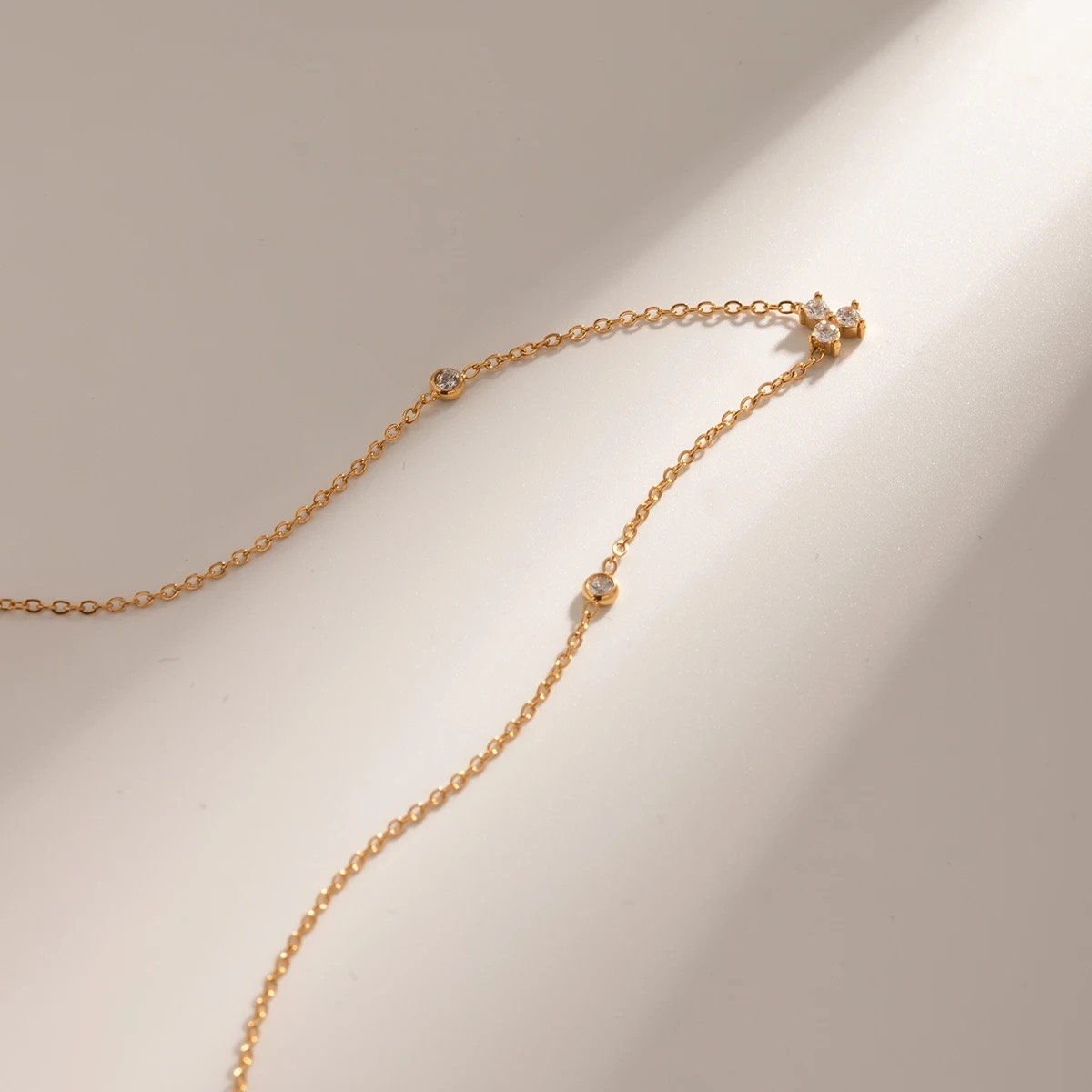 Lucky — gold-plated zircon charm necklace, detail