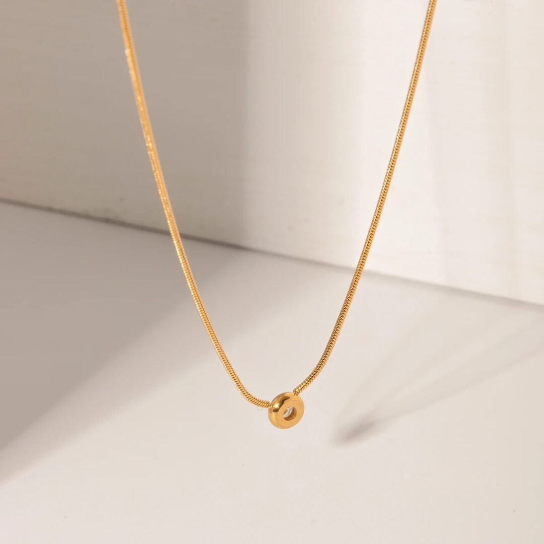 Astra Gem — gold-plated zircon pendant on fine chain