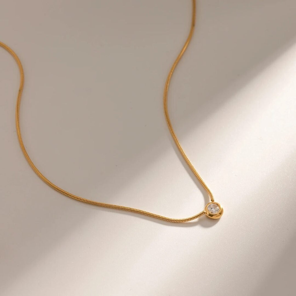 Astra Gem — zircon pendant worn at the collarbone