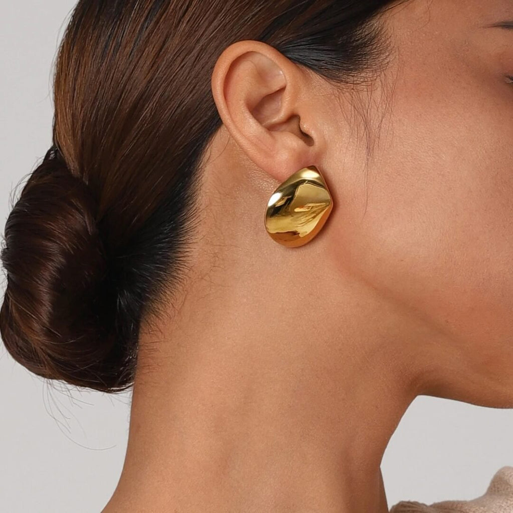 Mira Disk Earrings — gold-plated disc earrings worn on the ear