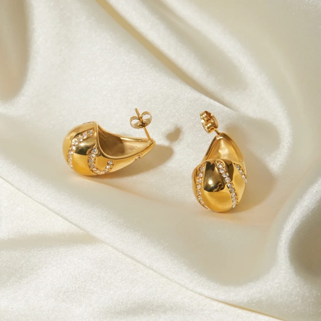Diamond Bodega Earrings — zircon gold-plated earrings worn on the ear