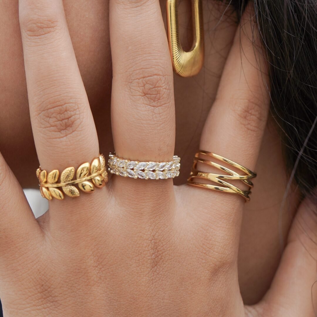 Lottie Ring — gold-plated adjustable band worn on the finger
