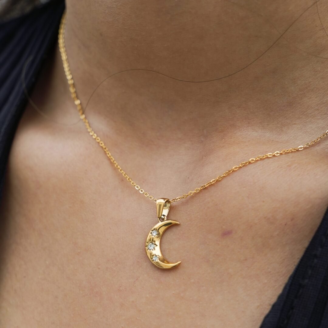 Crescent — gold-plated moon necklace worn at the collarbone
