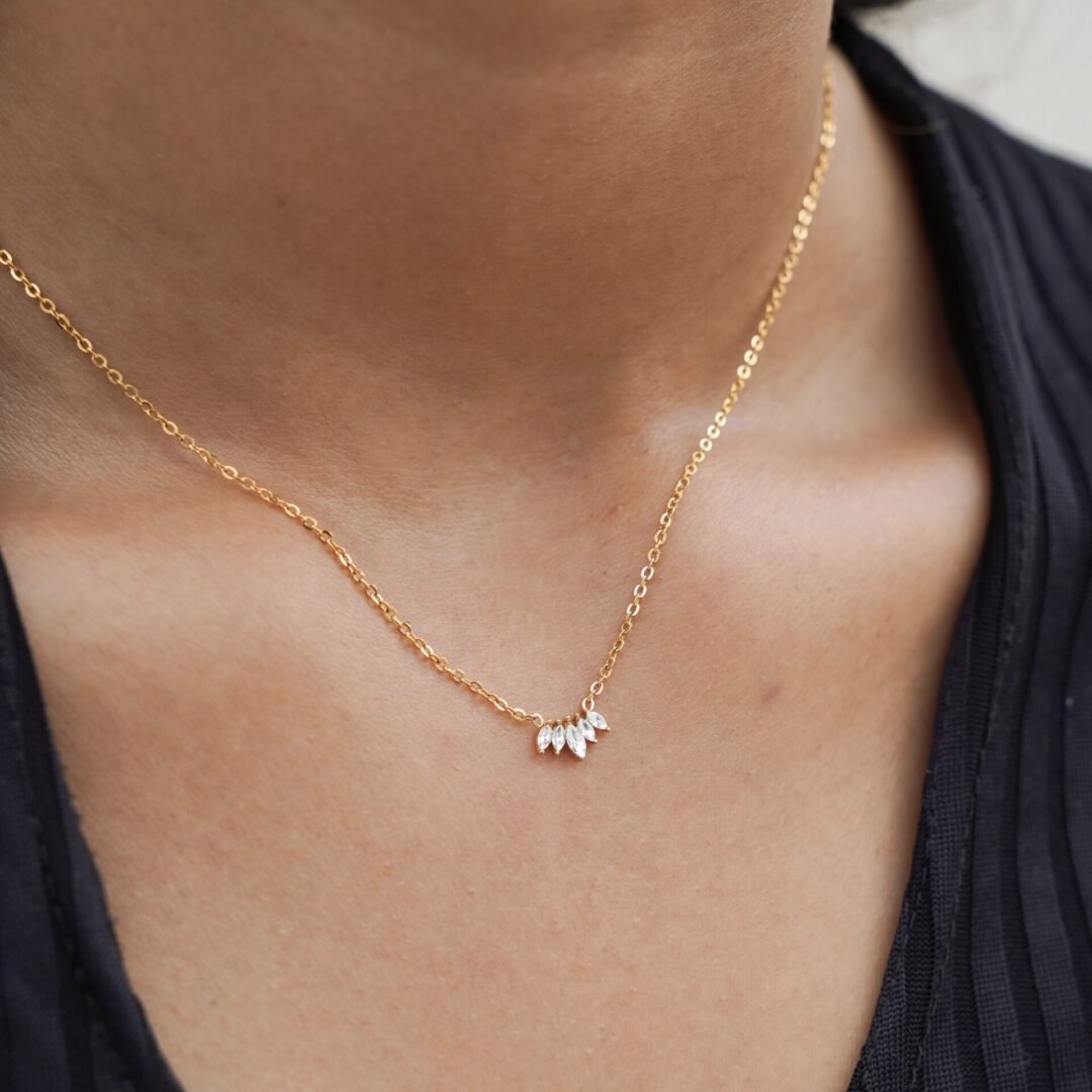 Crown Jewel — gold-plated zircon necklace worn at the collarbone