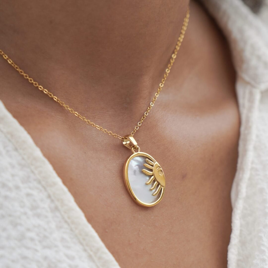 Sunrise — sun pendant necklace worn at the collarbone