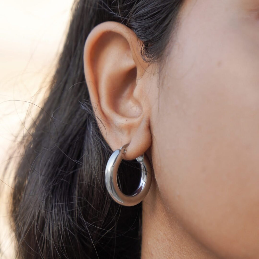 Medium Tube Hoops Silver — silver-plated hoops worn on the ear
