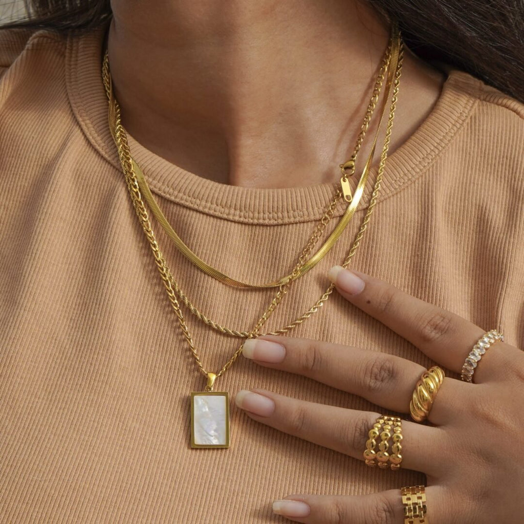 Lucia Chains — staggered layered necklace styled on model