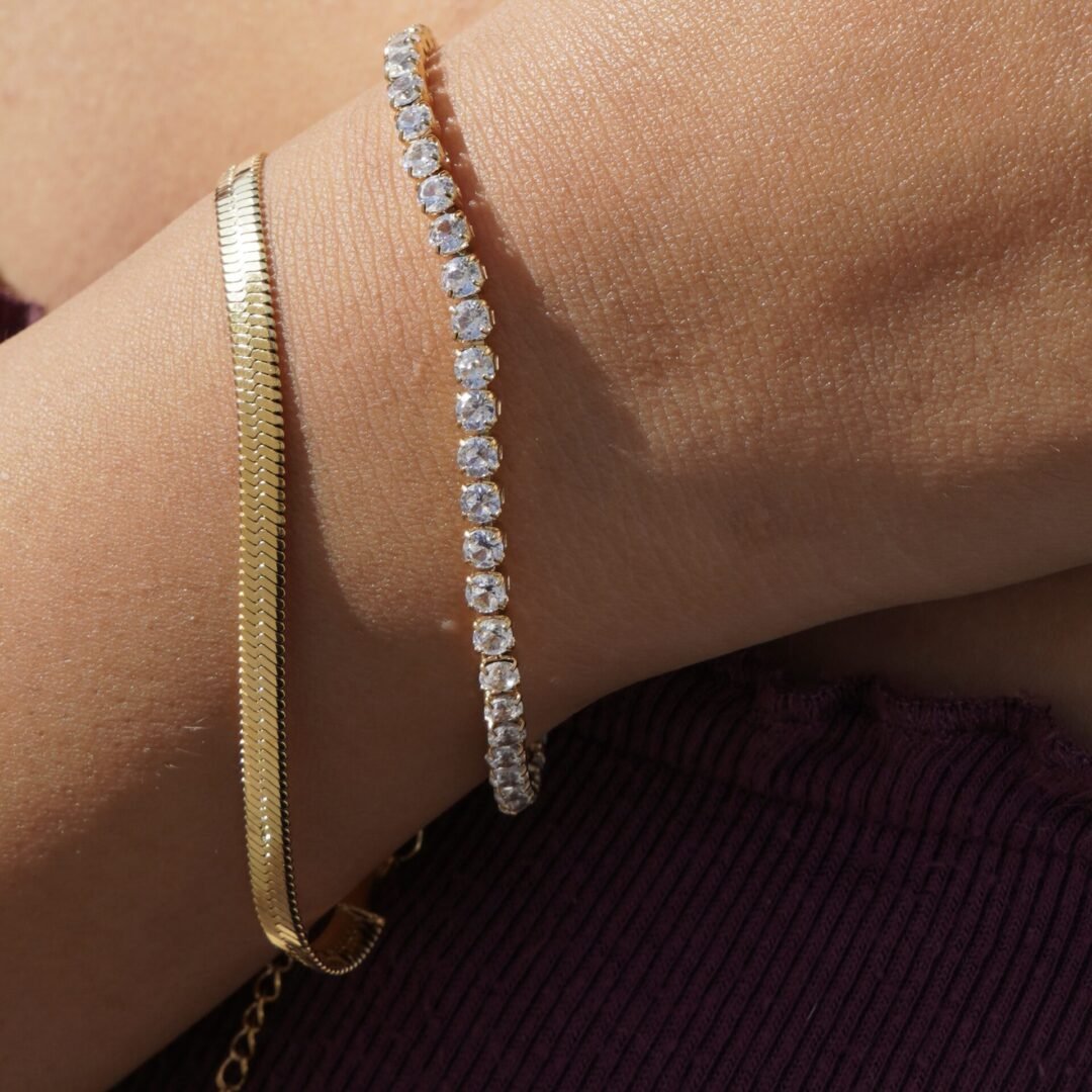 Herringbone Bracelet — flat gold chain worn on the wrist