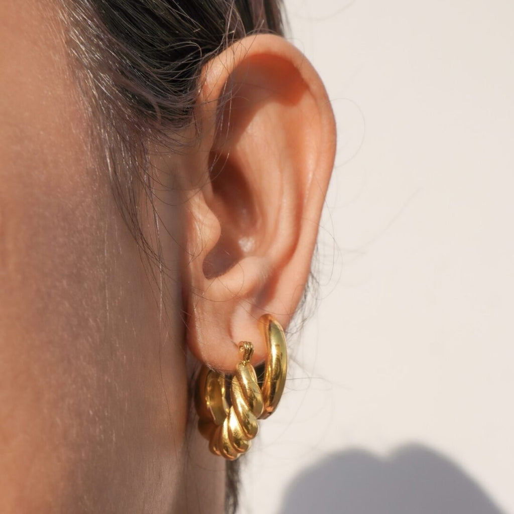 Basic Tube Hoops Small — gold-plated hoop earrings styled flat lay
