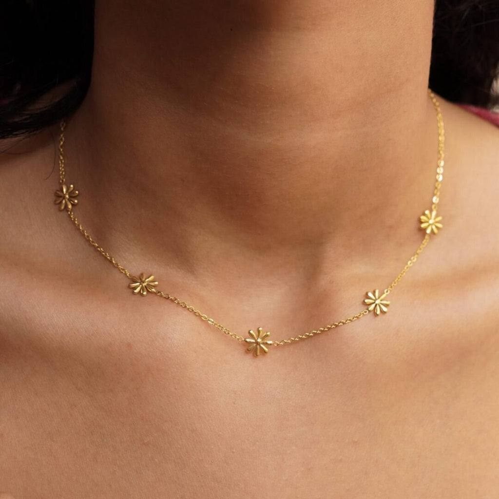 Petite Daisies — gold-plated daisy chain worn at the collarbone