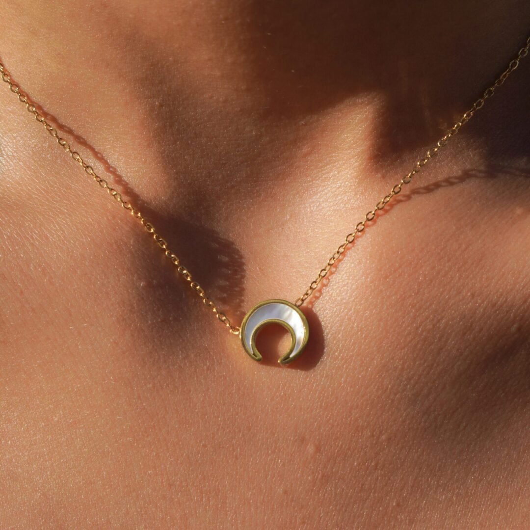 White Moon — gold-plated white shell necklace worn at the collarbone