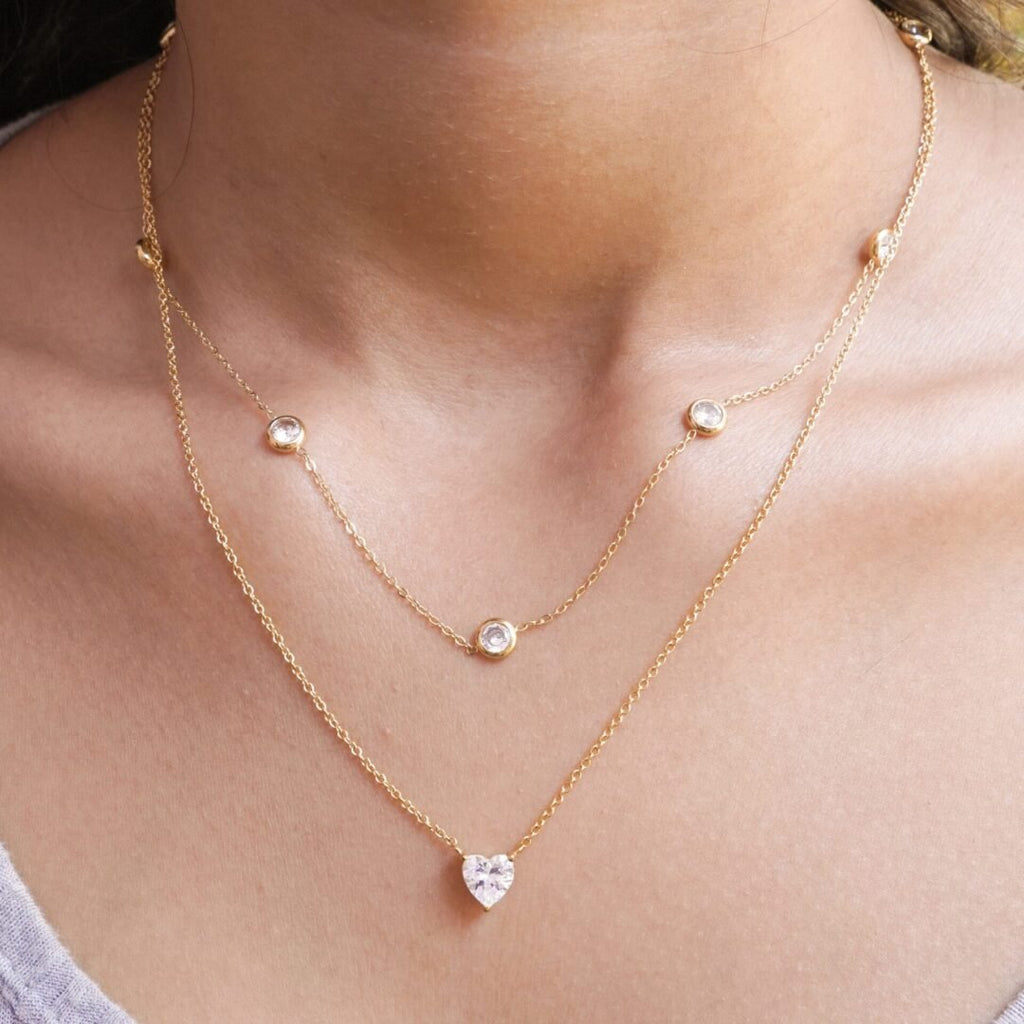 Jewel — zircon solitaire necklace worn at the collarbone