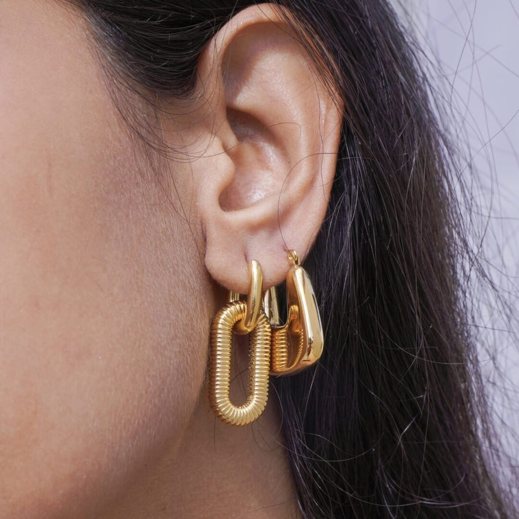 Bianca Hoops Gold — gold hoops worn on the ear