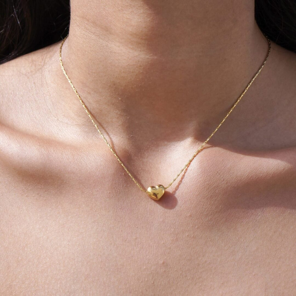 Sweetheart — heart necklace worn high on the neck