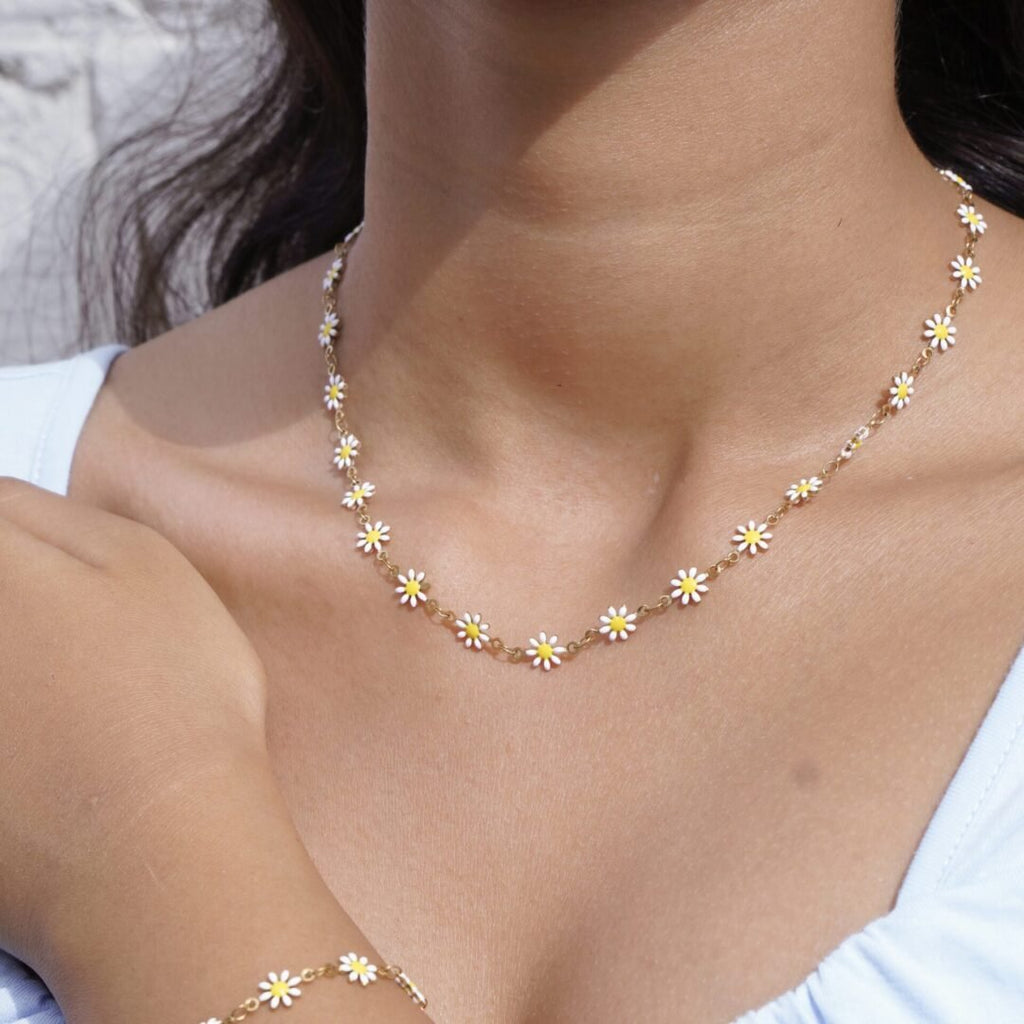 Daisies Necklace — gold-plated daisy chain worn at the collarbone