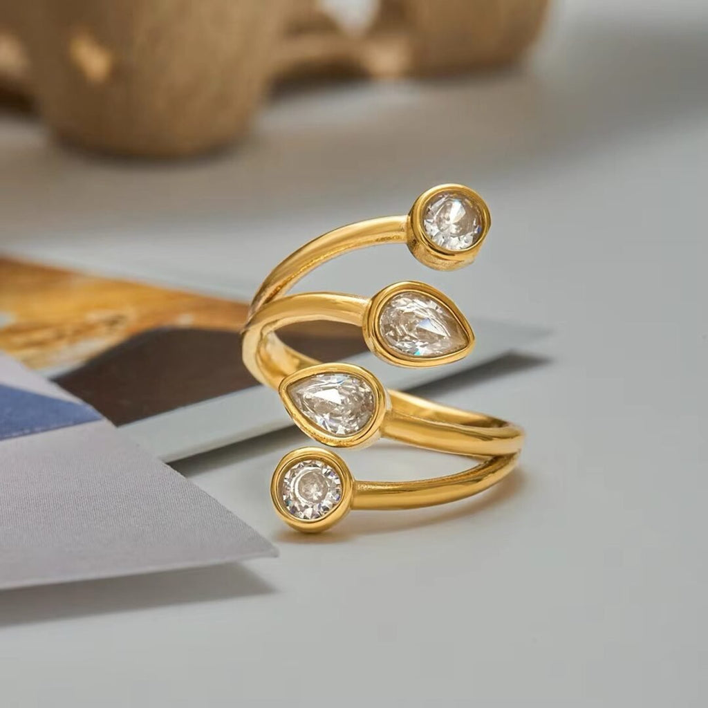 Wrapped — gold wrap ring styled on the hand