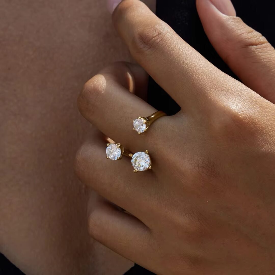 Trinity — interlocking three-band ring in 18k gold-plated stainless steel, front view