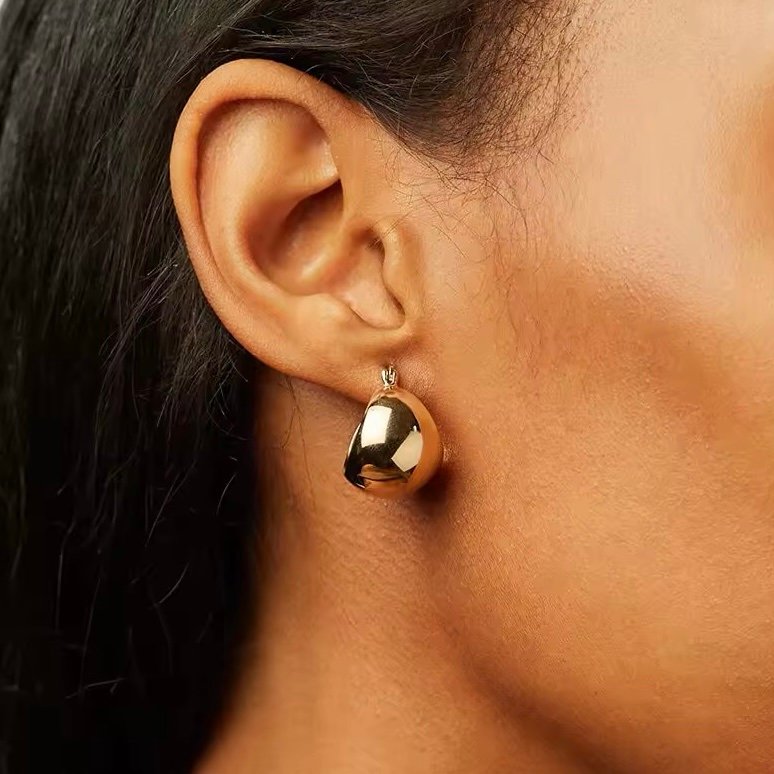 Belle Hoops — gold-plated hoop earrings worn on the ear