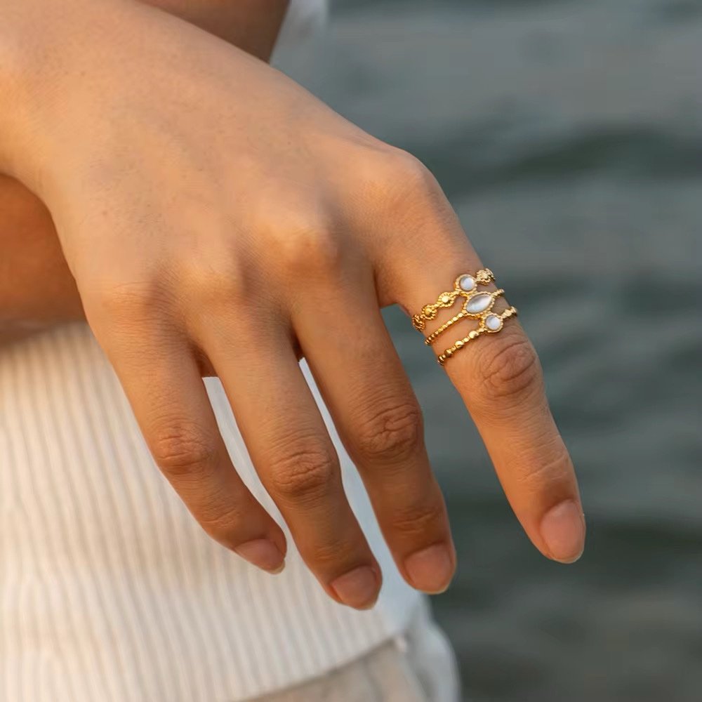 Opalite — opalite ring worn on the finger