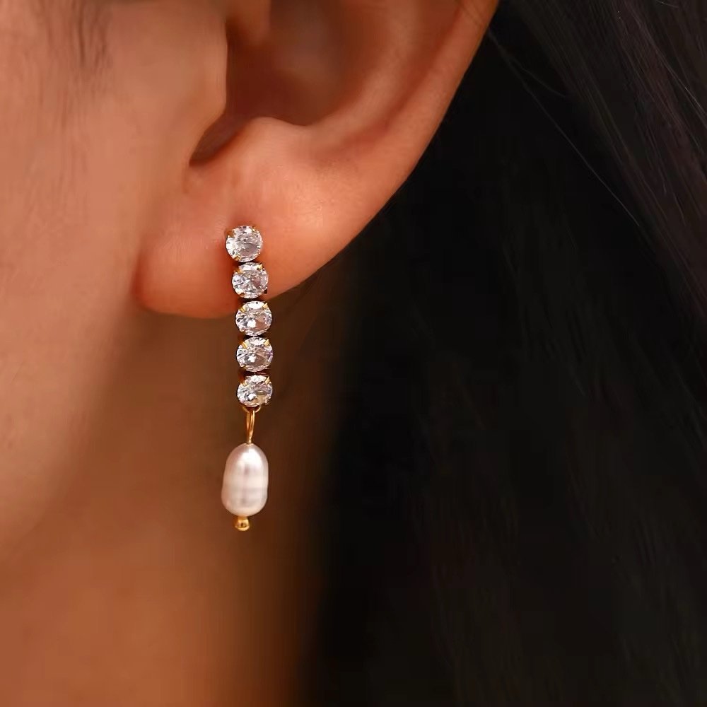 Pearl Spark — gold-plated zircon earrings worn on the ear