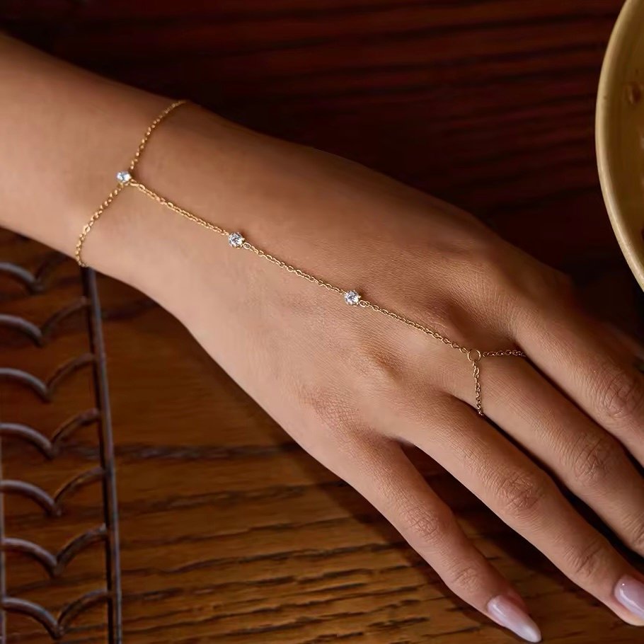 Divette Hand Chain — zircon hand chain in 18k gold-plated stainless steel, front view