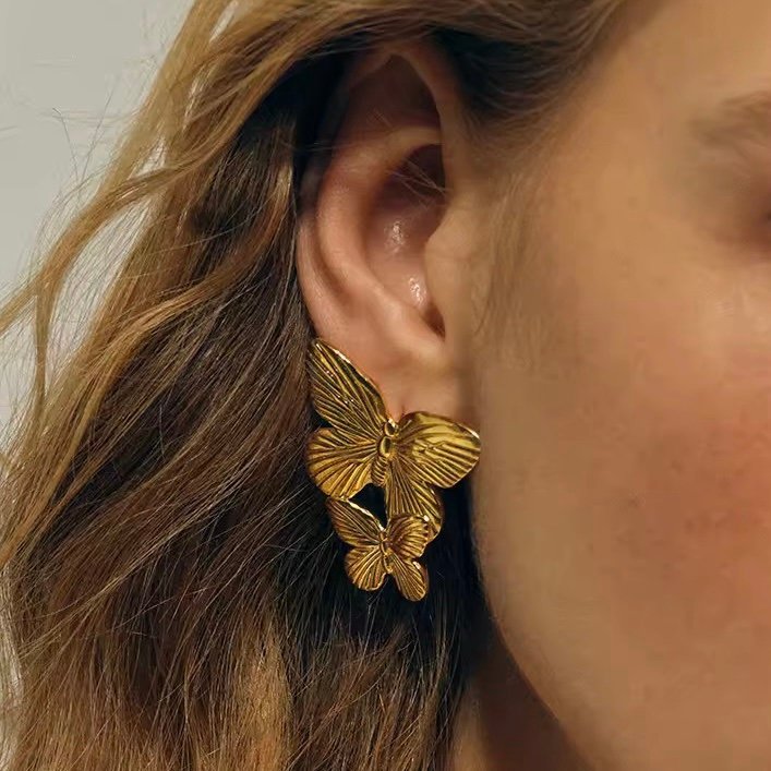 Wings — wing earrings worn sweeping up the ear