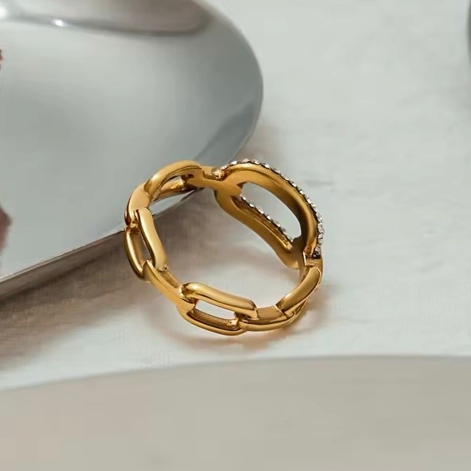 Connect — gold band ring styled on the hand