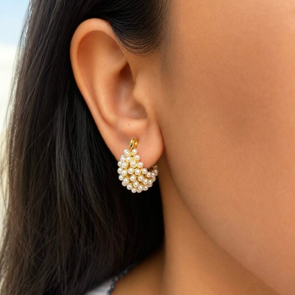 Belle Pearl — pearl and gold-plated hoop earrings worn on the ear