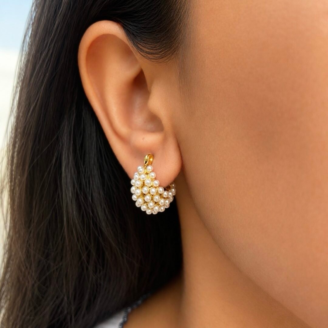 Belle Pearl — pearl and gold-plated hoop earrings worn on the ear