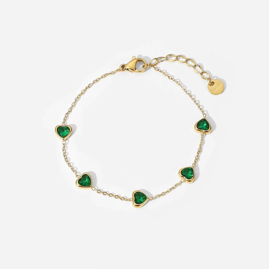 Emerald Hearts — green zircon heart bracelet in 14k gold-plated stainless steel, front view