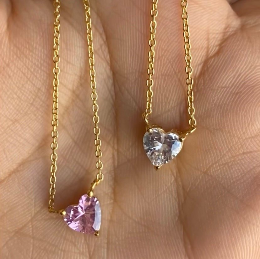 Gem Heart — zircon heart necklace styled flat lay