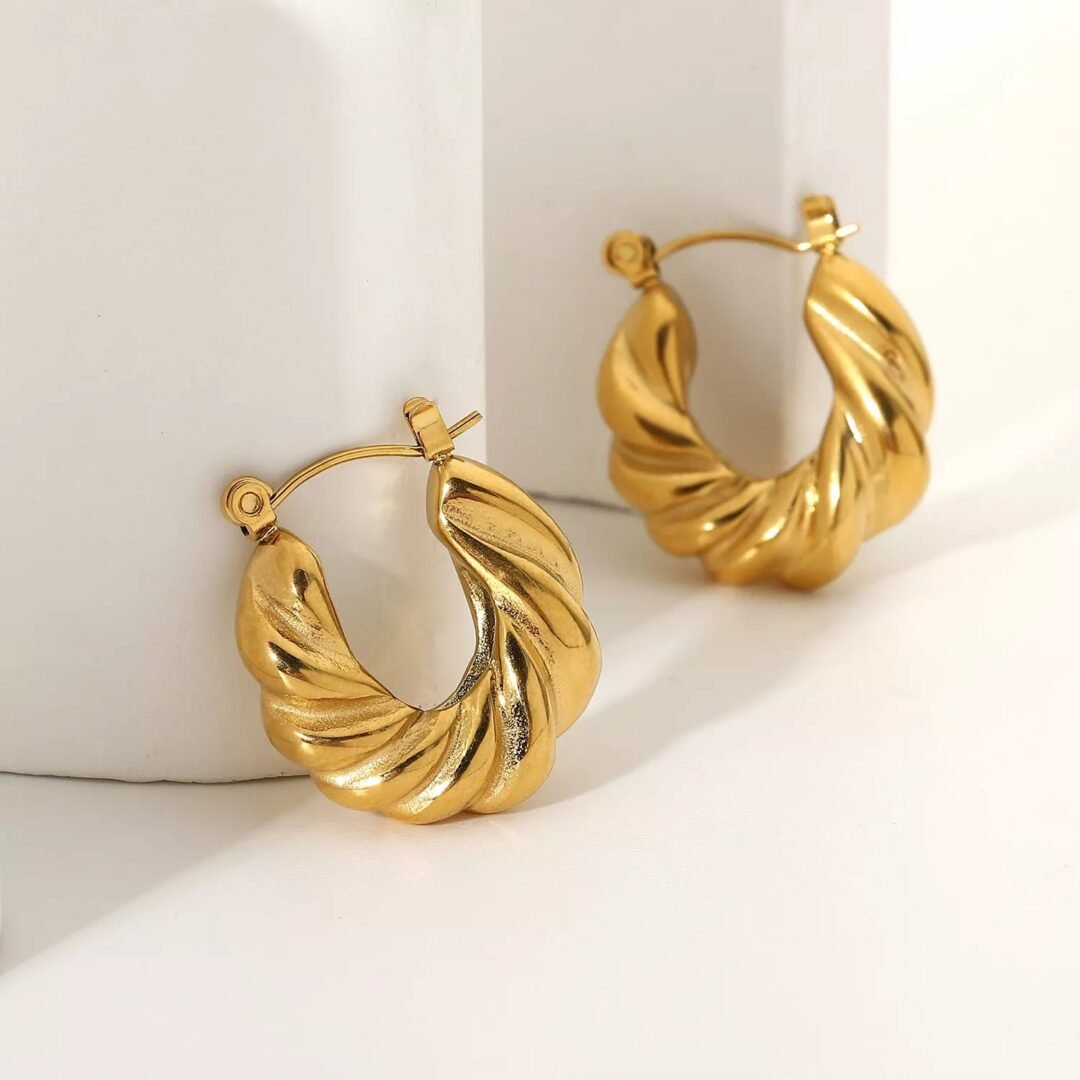 Croissant Hoops — thick gold-plated hoops worn on the ear