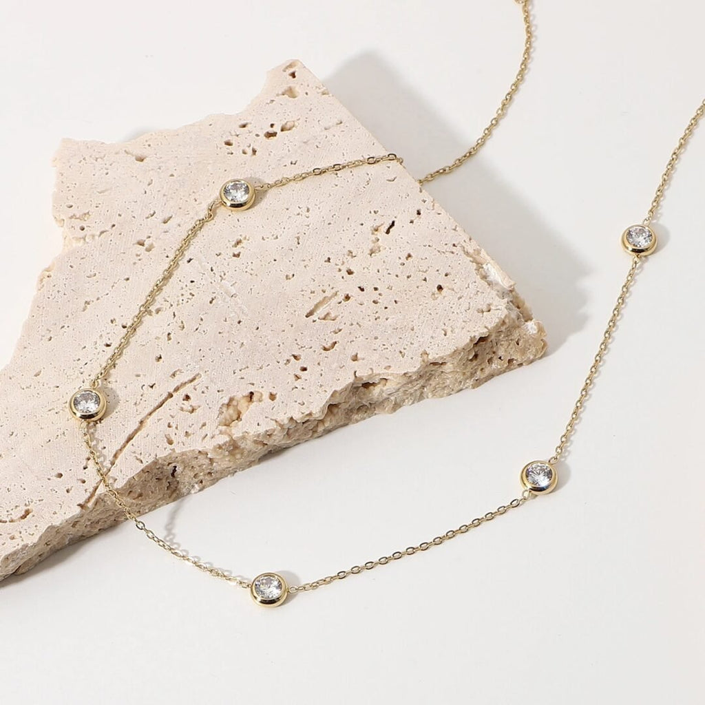 Jewel — close-up of white zircon setting on fine chain