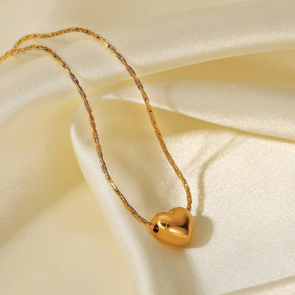 Sweetheart — close-up of heart pendant and fine chain