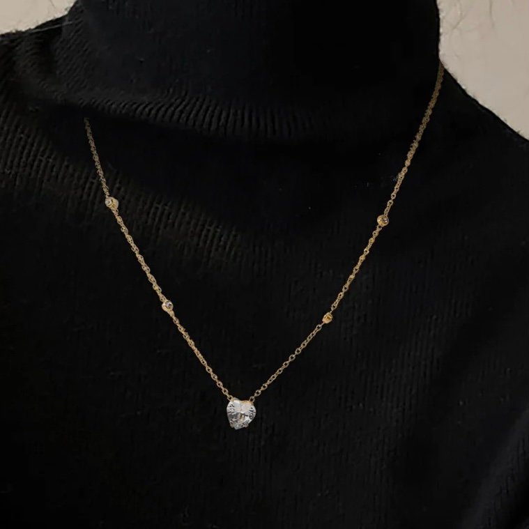 Zircon Heart Necklace — heart pendant and chain, flat lay
